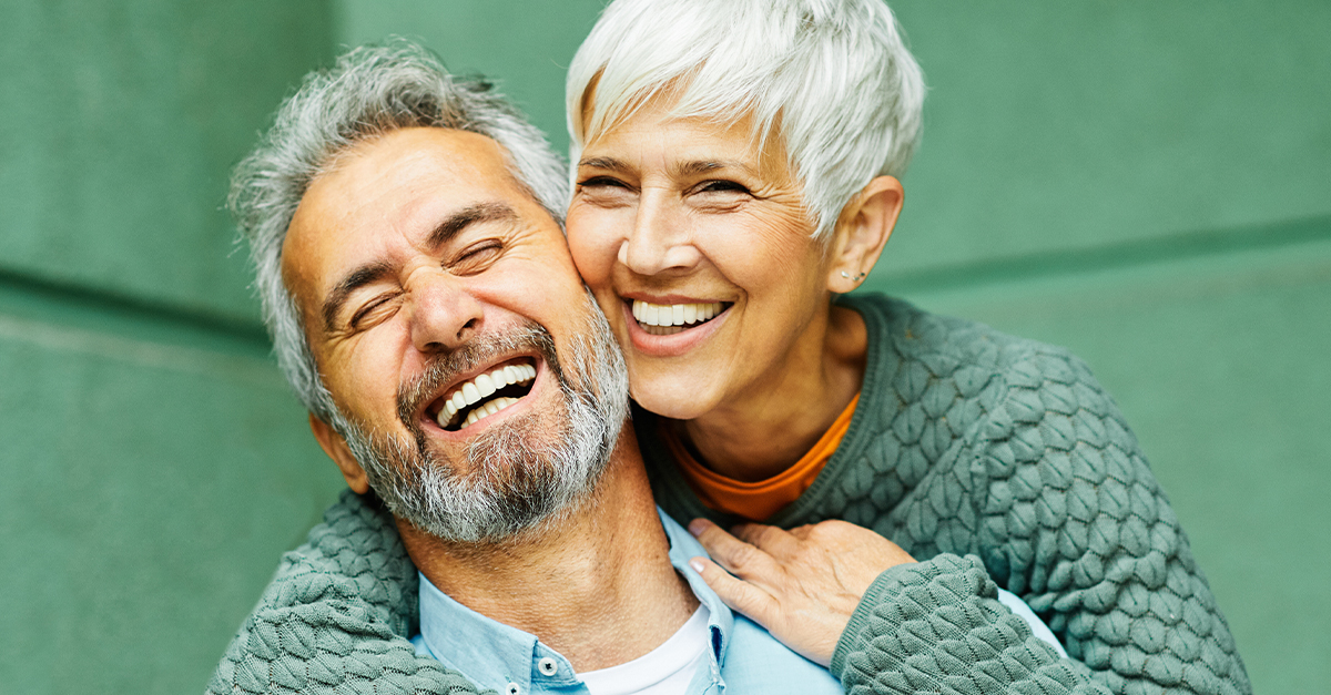 a happy older couple embracing