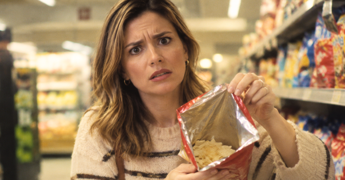 Disappointed Shopper Shows Empty Snack Bag