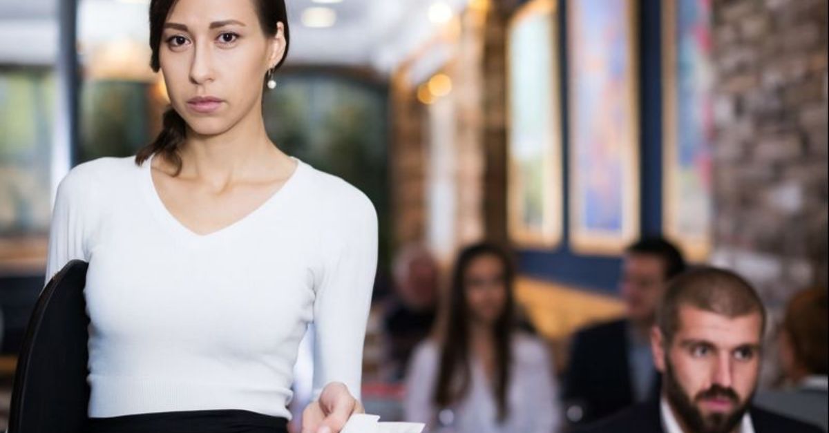 1859768833 -BearFotos- Portrait of employee waitress with serving tray with tips indoors