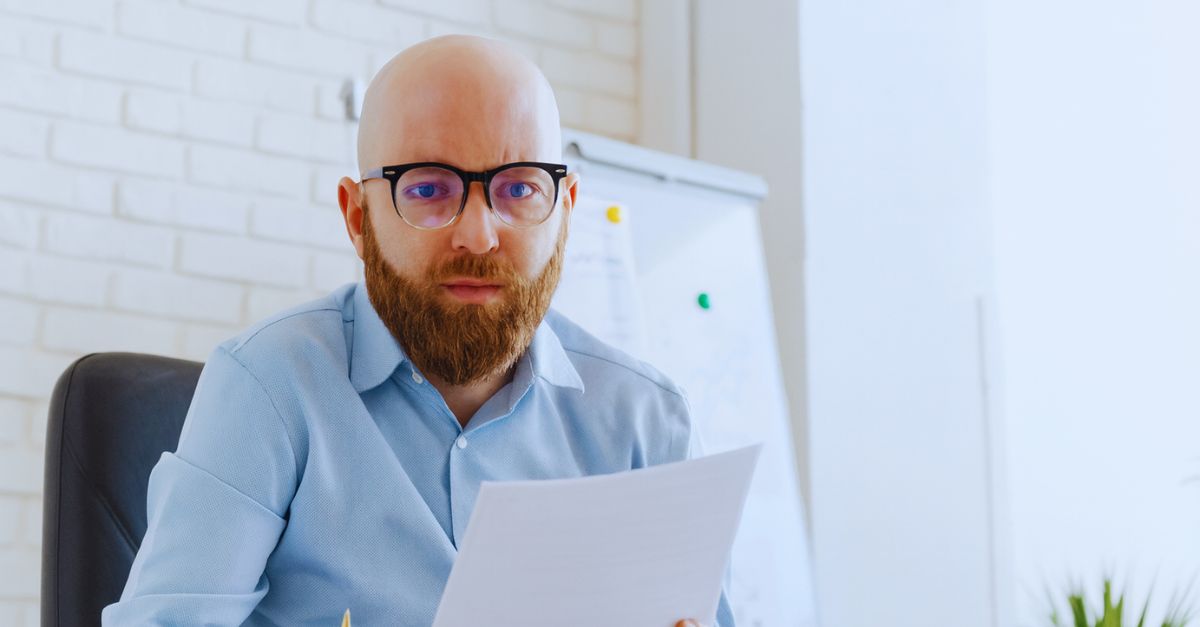 Man looking at tax documents