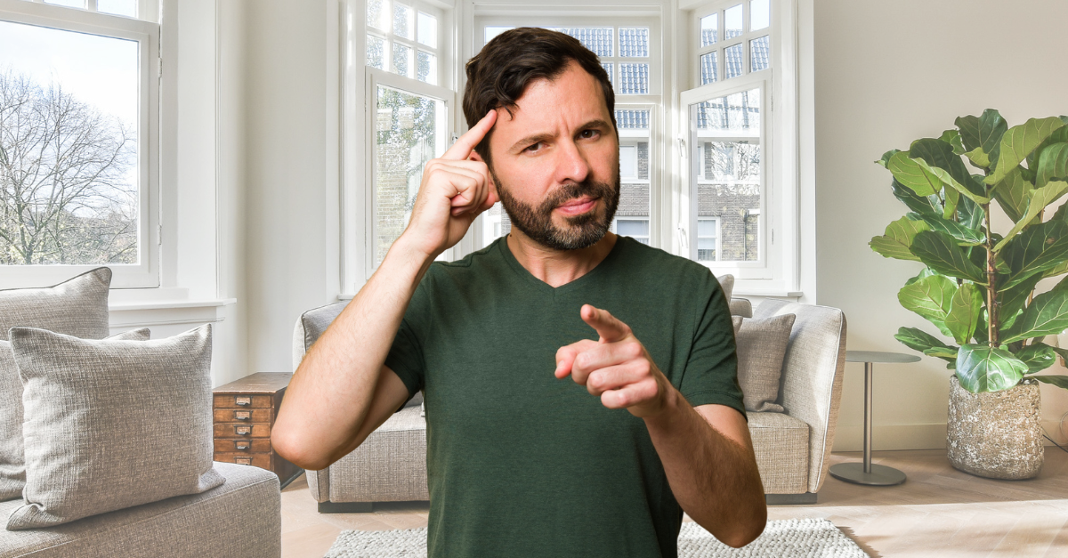 Smart man pointing to his head