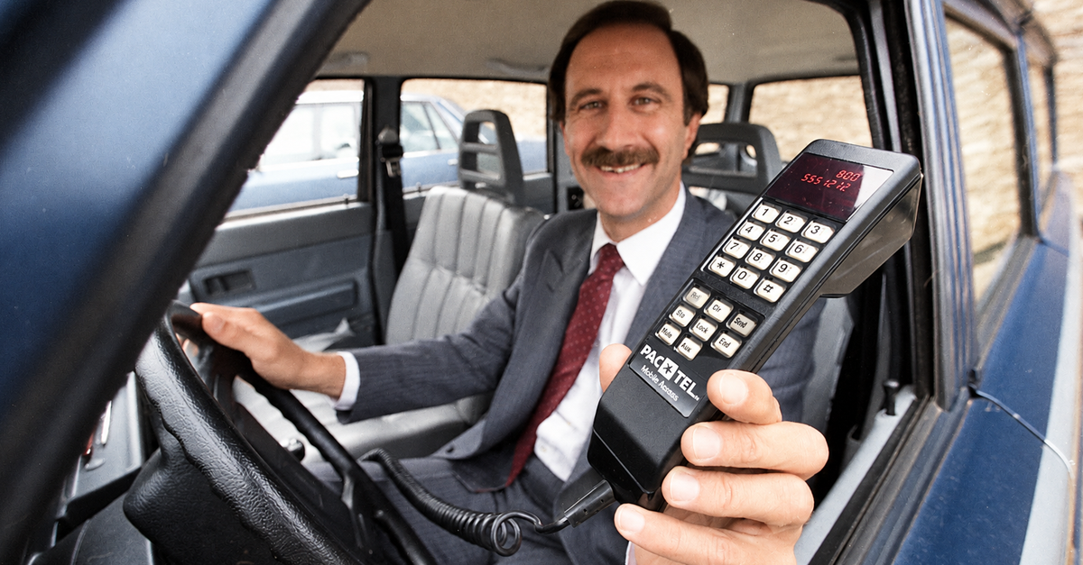 Nov. 14, 1984: Al Feinman with PacTel Mobile Services displays a new cellular phone