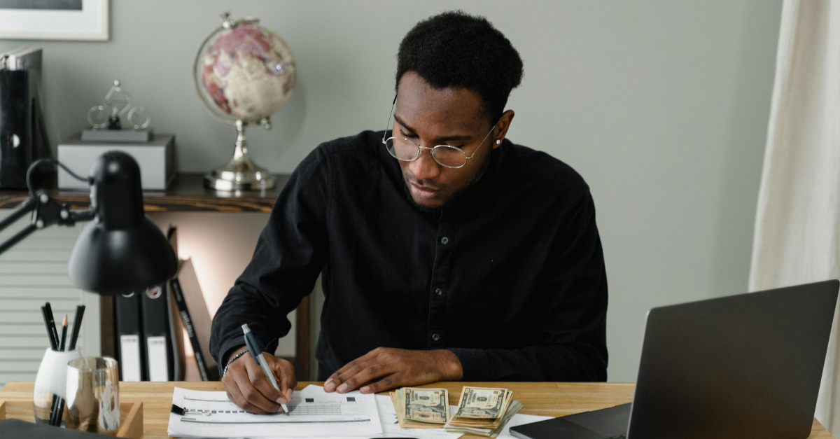 a-man-writing-on-the-paper