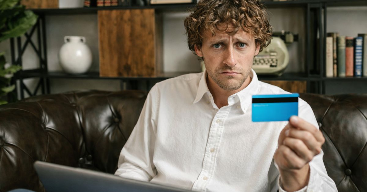 Worried man with credit card