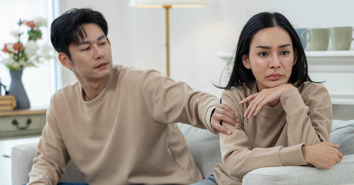A couple sitting on a couch