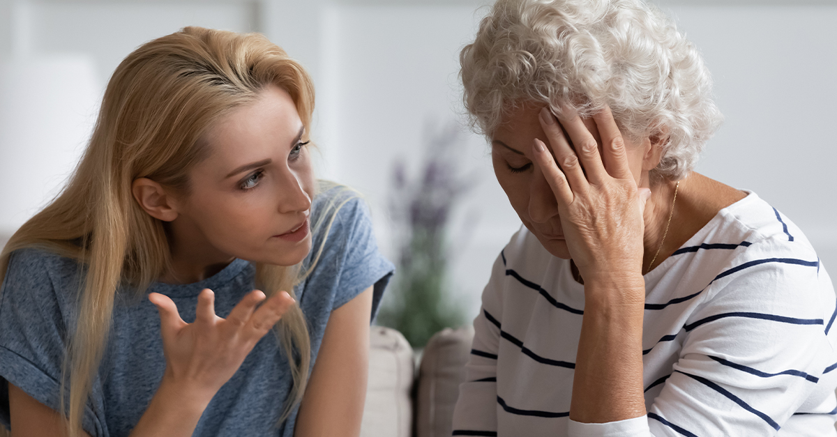 A daughter and elderly mother having an argument.