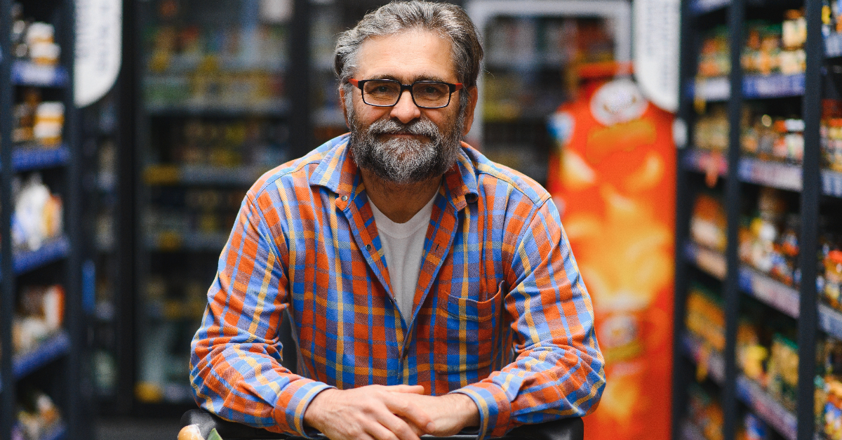 Handsome senior man shopping in a supermarket
