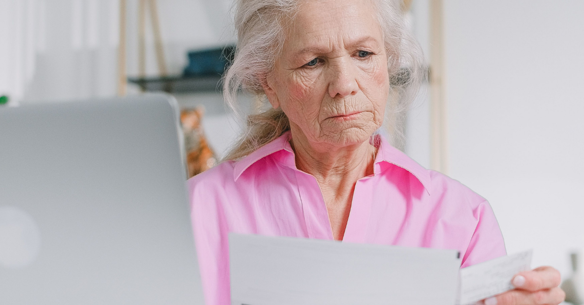 elderly-woman-looking-at-documents