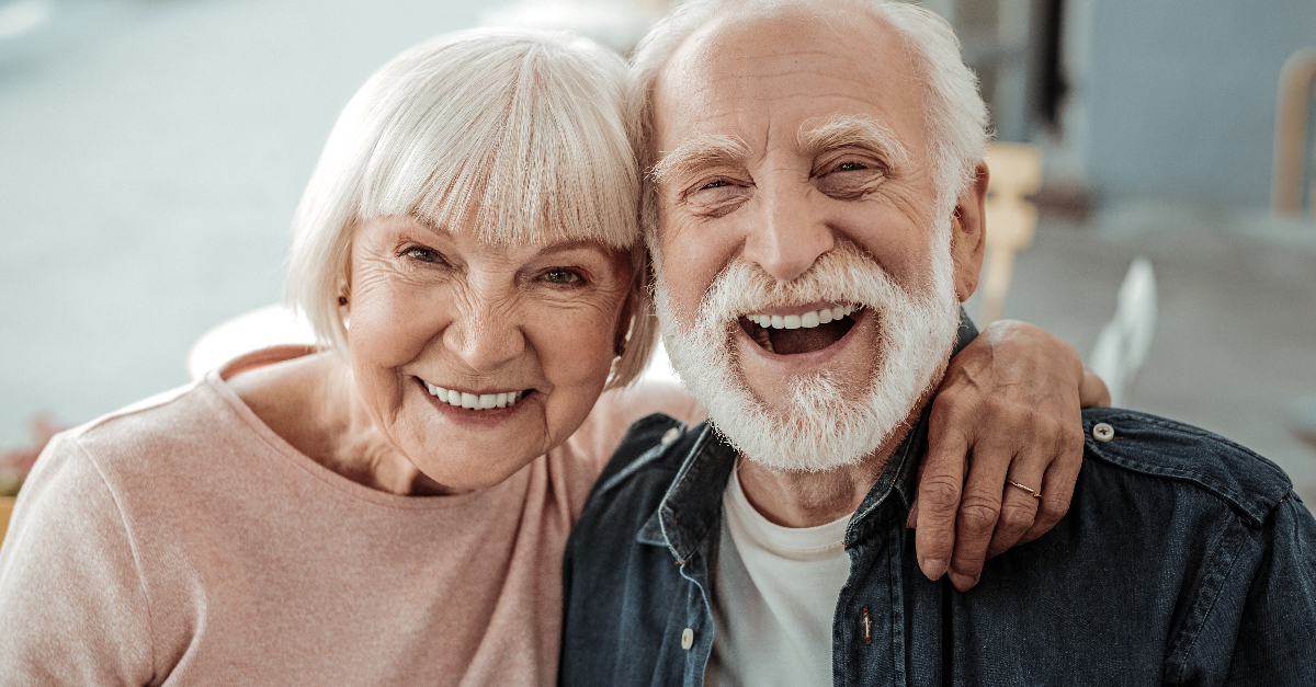 Joyful nice elderly couple smiling