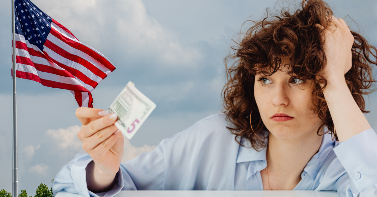 curly-haired-woman-holding-a-paper-money