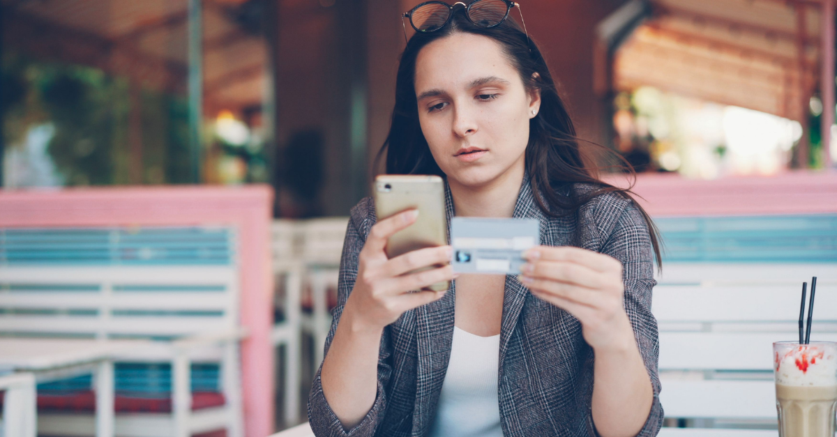 woman-shopping-online-with-credit-card-and-phone