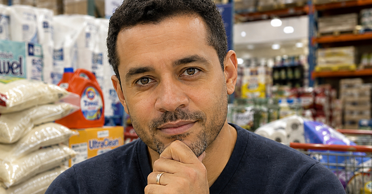 A man shopping for bulk purchases, looking directly at the viewer.