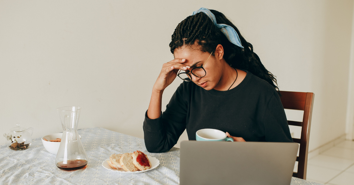 woman-watching-laptop-during-breakfast