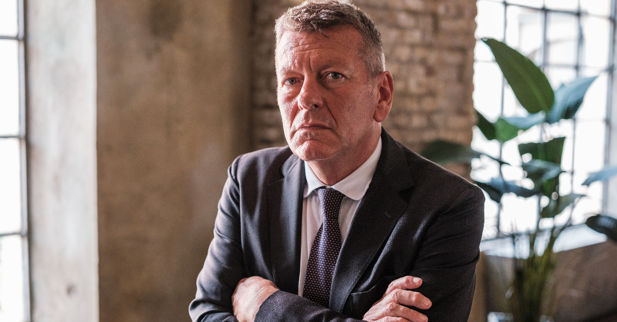 boss in his office with a serious face