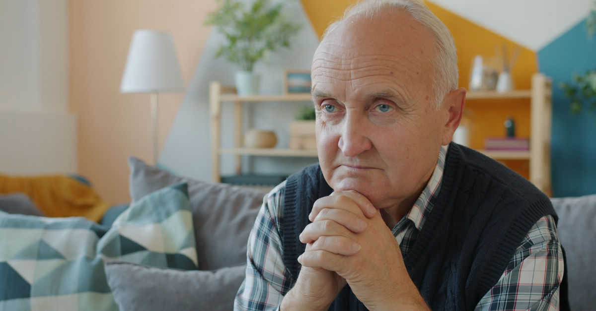 pensive-senior-man-relaxing-at-home