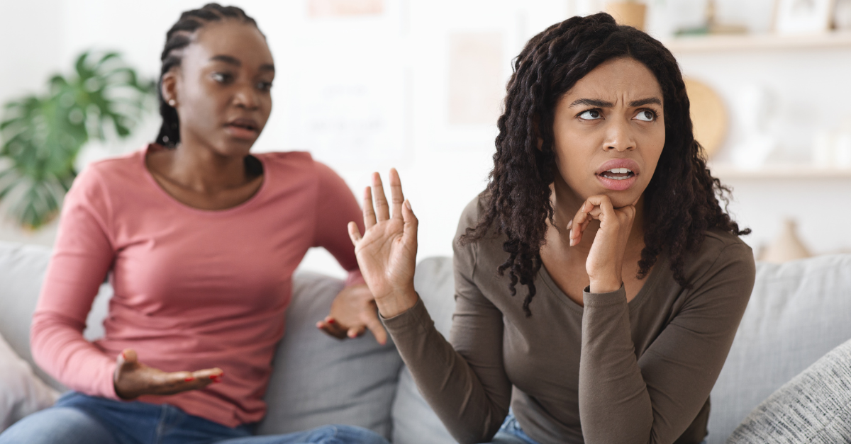 Two african american women girlfriends fighting at home